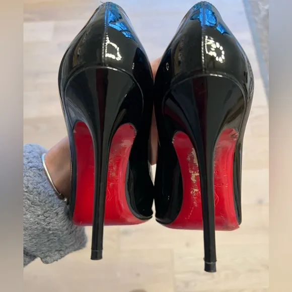 Black patent leather Louboutin Decollette pumps