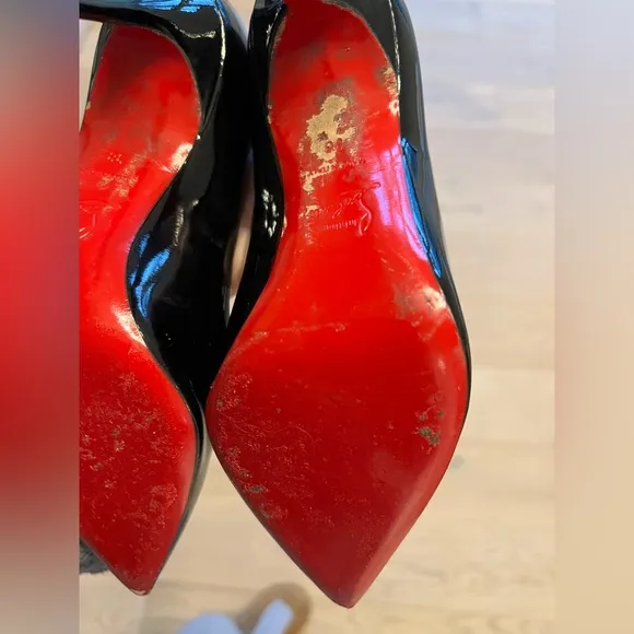 Black patent leather Louboutin Decollette pumps