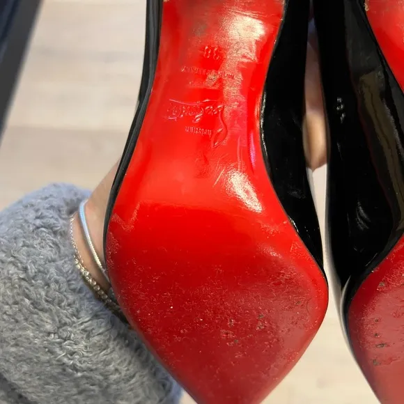 Black patent leather Louboutin Decollette pumps
