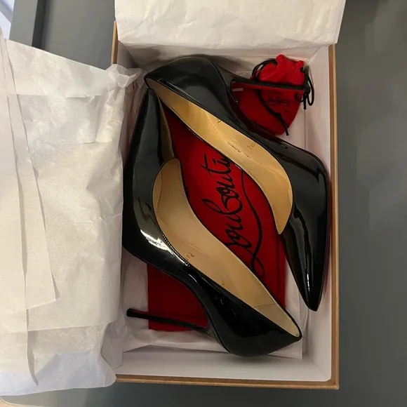 Black patent leather Louboutin Decollette pumps