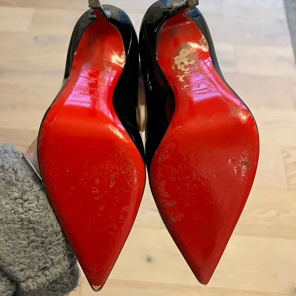 Black patent leather Louboutin Decollette pumps