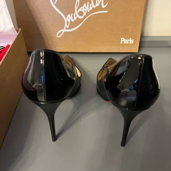 Black patent leather Louboutin Decollette pumps