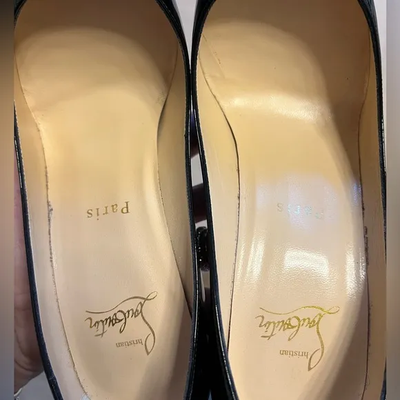 Black patent leather Louboutin Decollette pumps