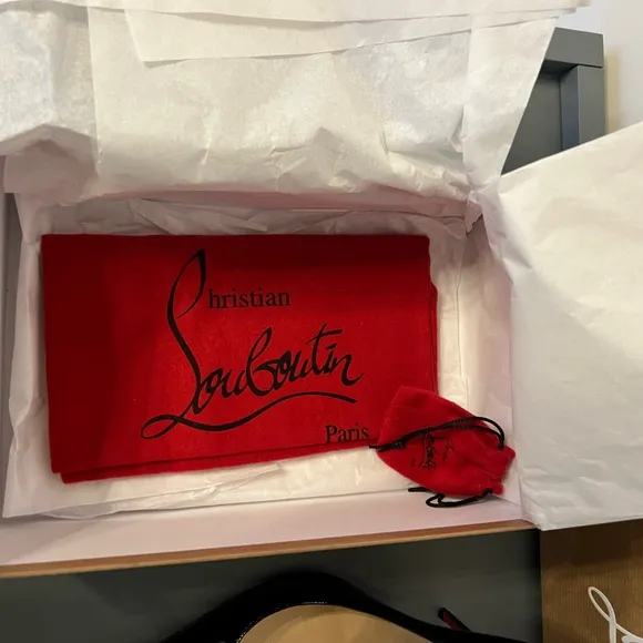 Black patent leather Louboutin Decollette pumps