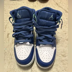 Blue, white and light green high top shoes