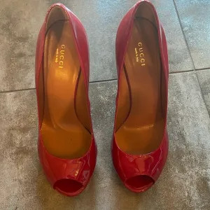 Gucci women’s peep toe pumps