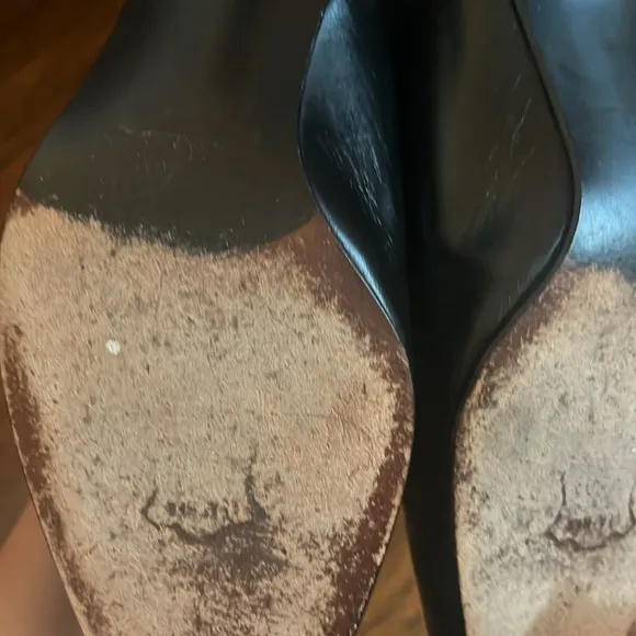 Stuart Weitzman Black and White Heels with Slingback Design and Pointed Toe .